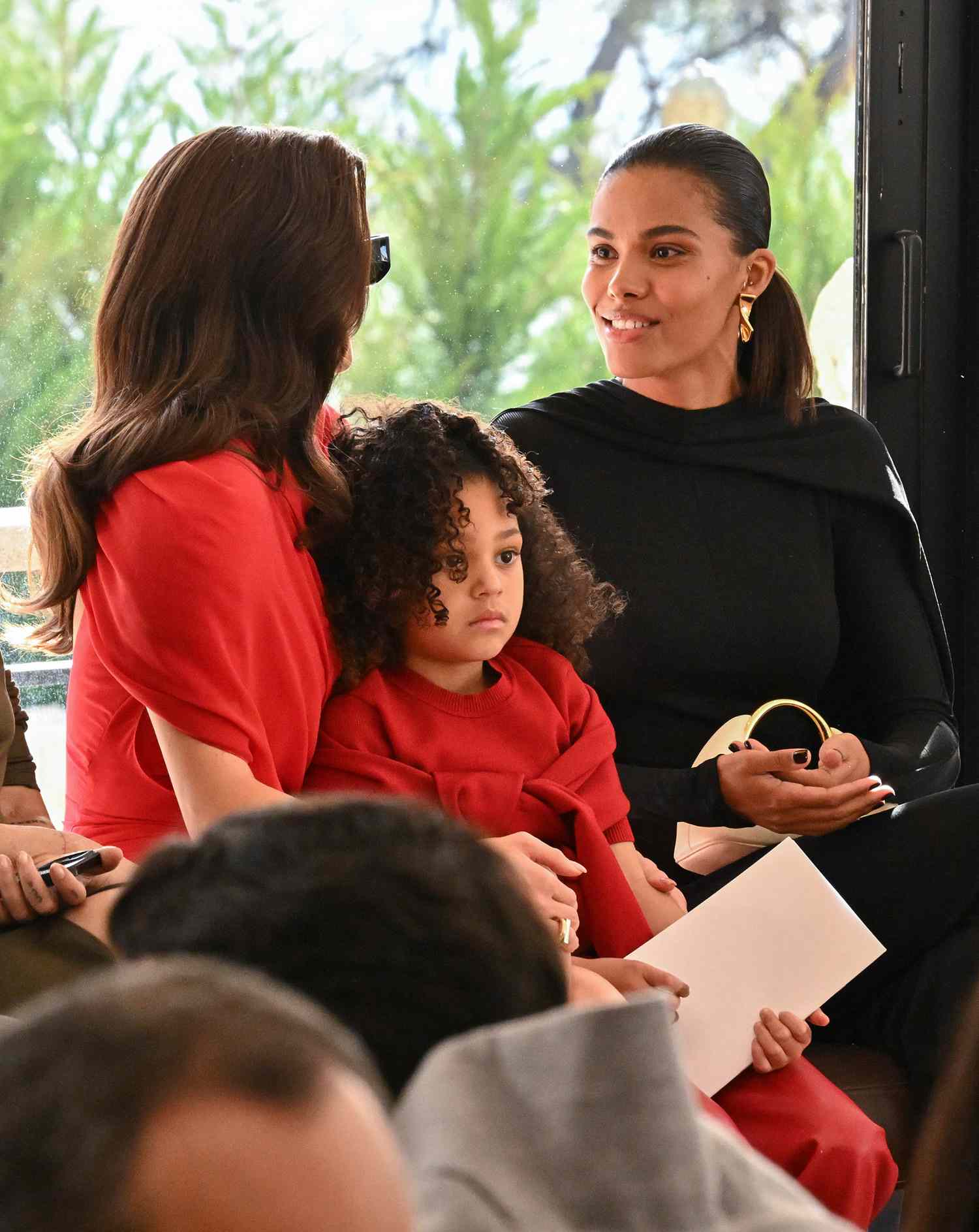 Kylie Jenner, Stormi Webster and Tina Kunakey attends the "Les Sculptures" Jacquemus' Fashion Show