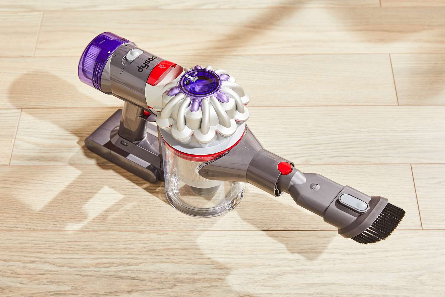 The Dyson V8 hand held part on a wooden floor