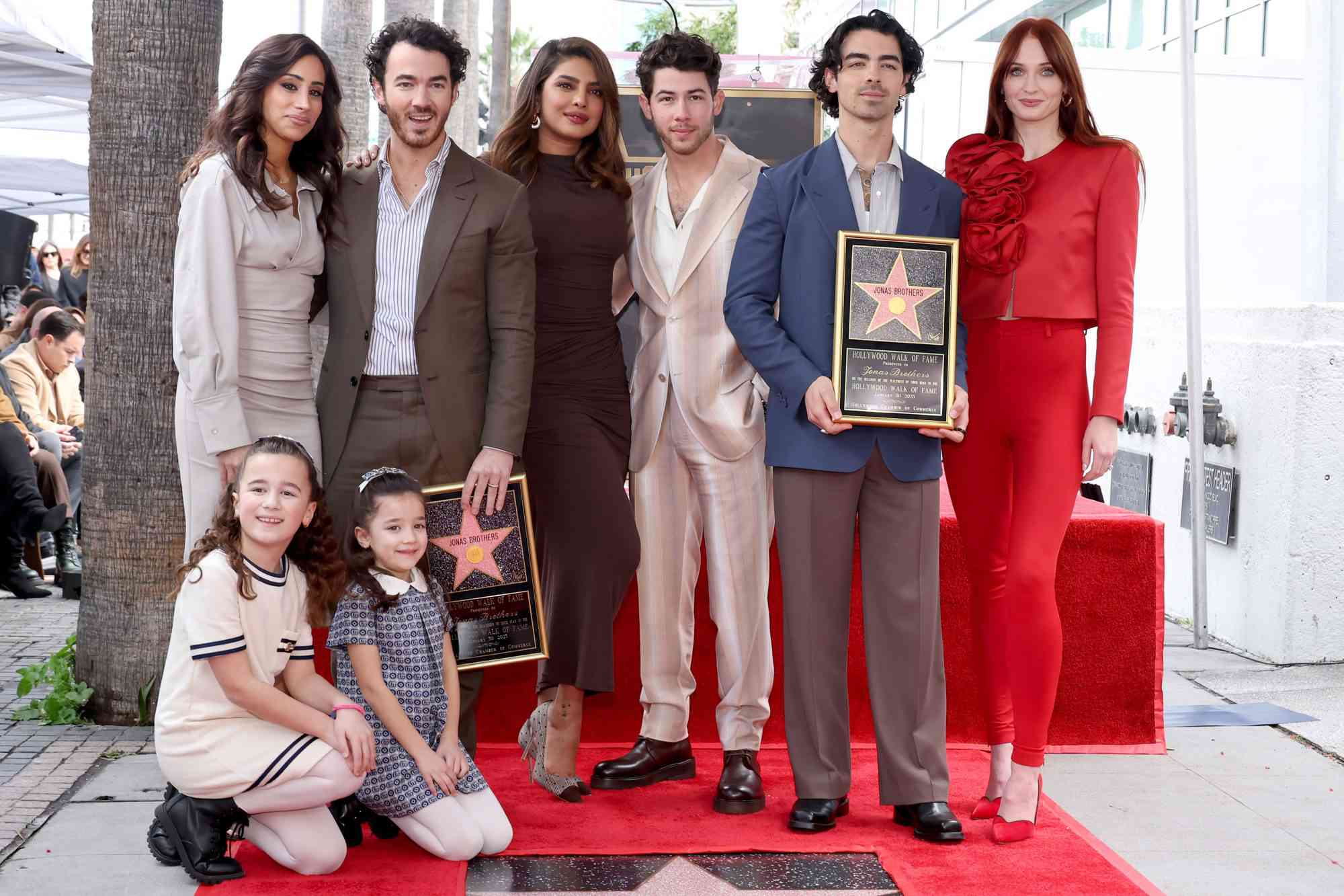 HOLLYWOOD, CALIFORNIA - JANUARY 30: (L-R) Danielle Jonas, Kevin Jonas, Priyanka Chopra, Nick Jonas, Joe Jonas, Sophie Turner, and (front) Alena Rose Jonas and Valentina Angelina Jonas attend The Hollywood Walk of Fame star ceremony honoring The Jonas Brothers on January 30, 2023 in Hollywood, California. (Photo by Amy Sussman/Getty Images)