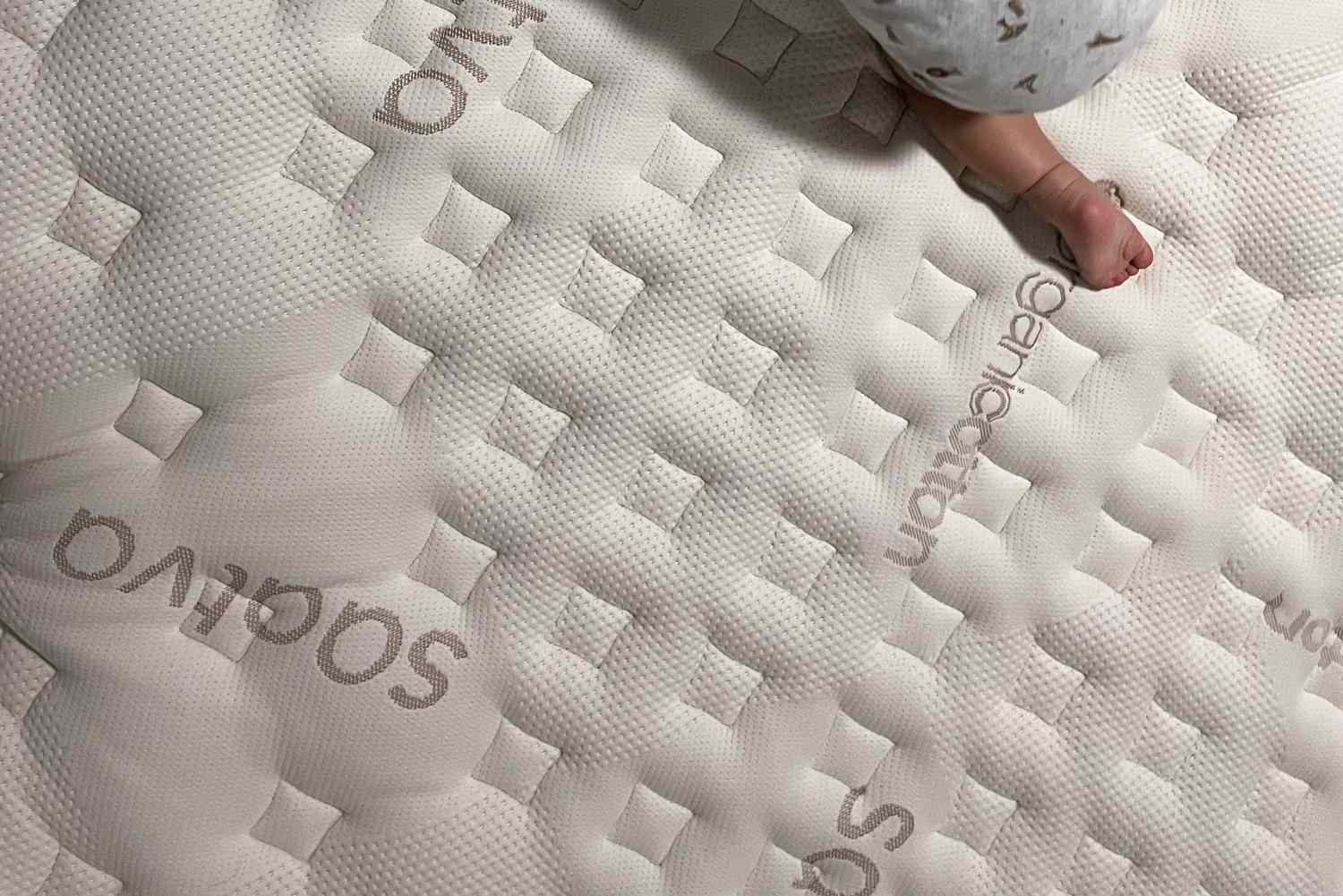 baby crawling on the Loom & Leaf Mattress Saatva mattress