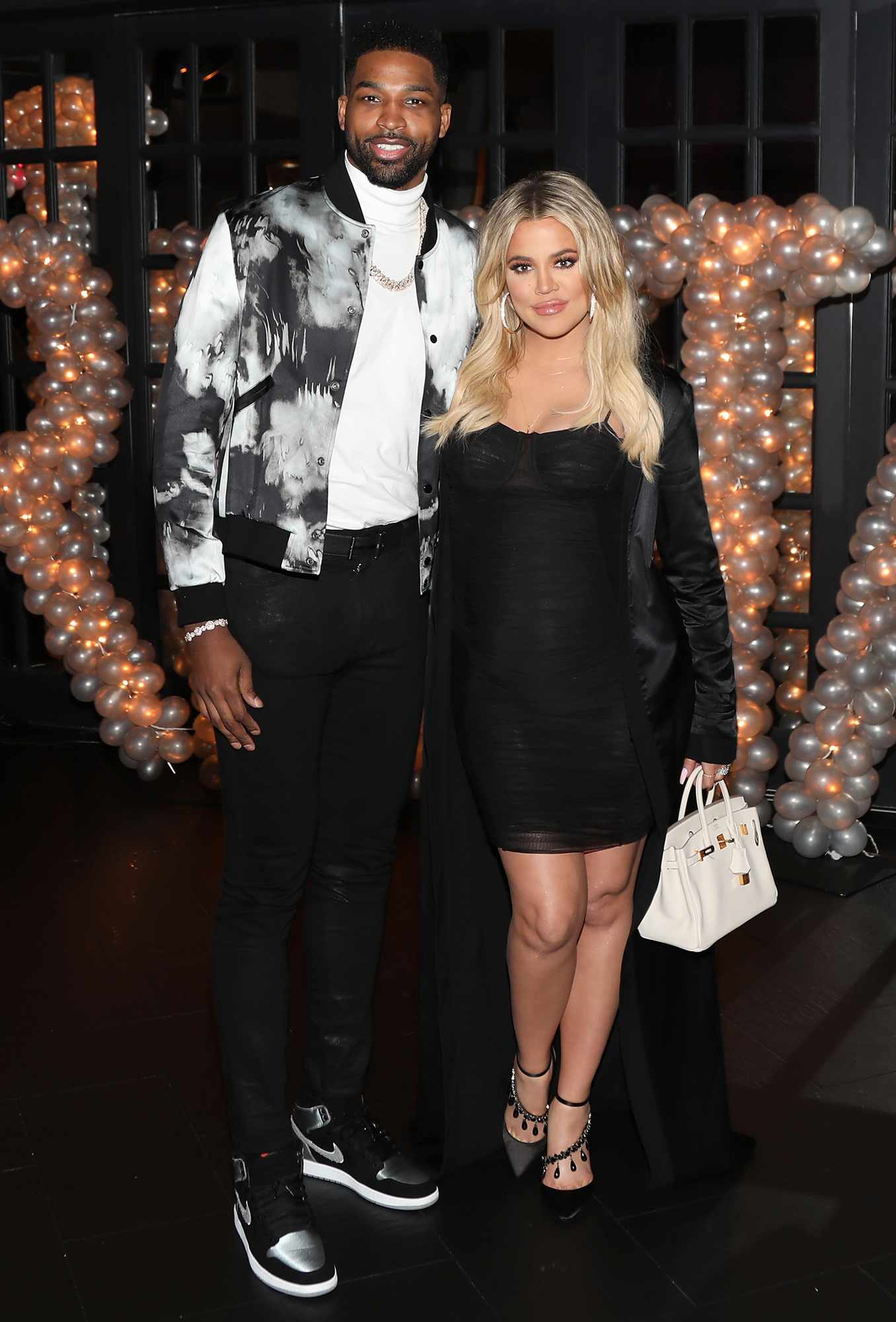 Tristan Thompson and Khloe Kardashian pose for a photo as Remy Martin celebrates Tristan Thompson's Birthday at Beauty & Essex on March 10, 2018 in Los Angeles, California