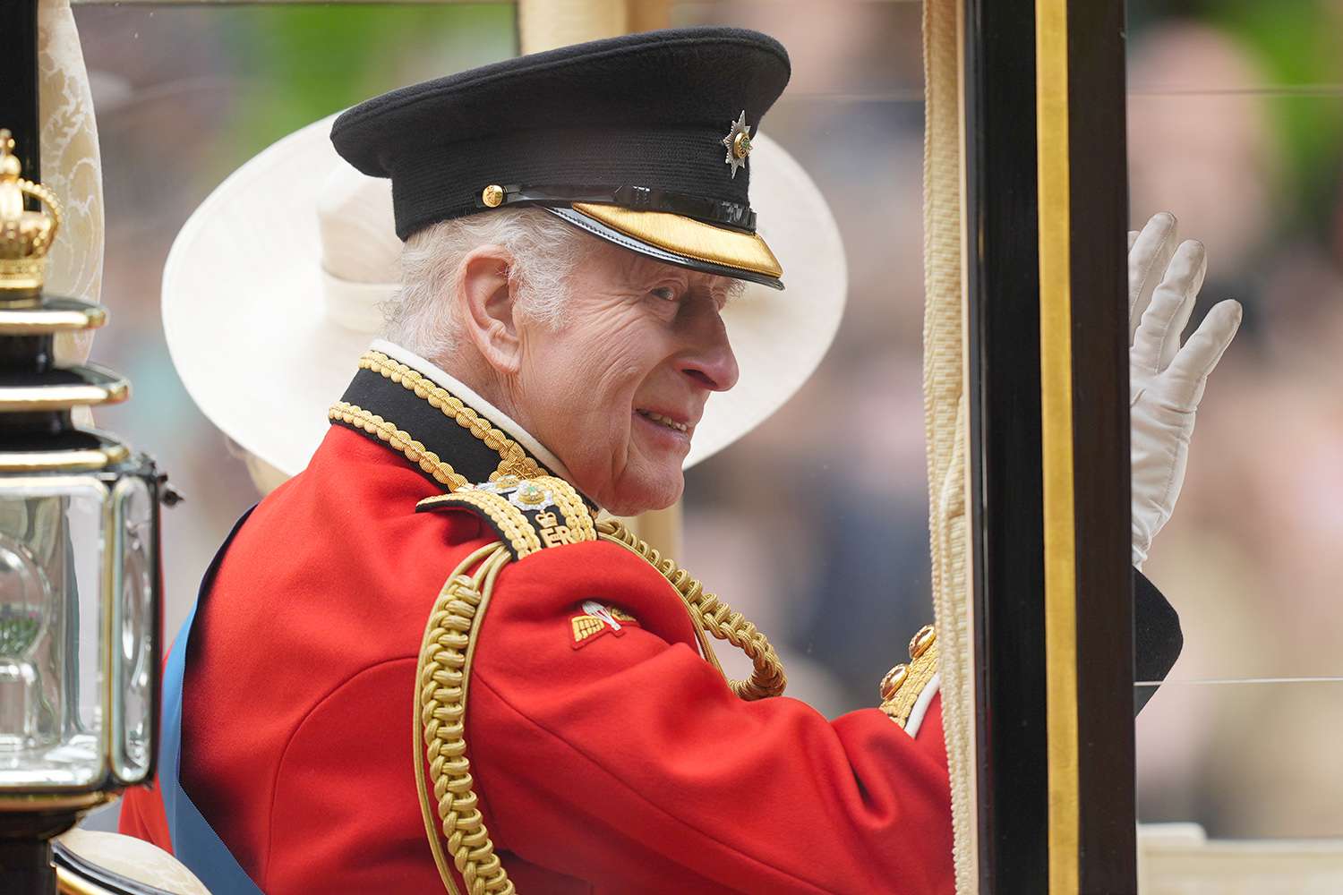 King Charles III and Queen Camilla travel along The Mall to the Trooping the Colour ceremony at Horse Guards Parade