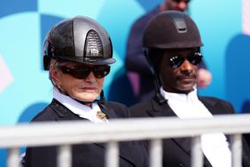 Snoop Dogg and Martha Stewart watching the Dressage Team Grand Prix Special at the Chateau de Versailles on the eighth day of the 2024 Paris Olympic Games in France. Picture date: Saturday August 3, 2024