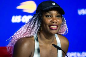 Venus Williams of the United States talks to the media after losing to Greet Minnen of Belgium in the first round on Day 2 of the US Open 