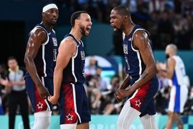 USA's #04 Stephen Curry (L) and USA's #07 Kevin Durant celebrates after scoring in the men's Gold Medal basketball match between France and USA during the Paris 2024 Olympic Games at the Bercy Arena in Paris on August 10, 2024