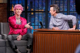 Pictured: (l-r) Machine Gun Kelly during an interview with host Seth Meyers on June 29, 2022