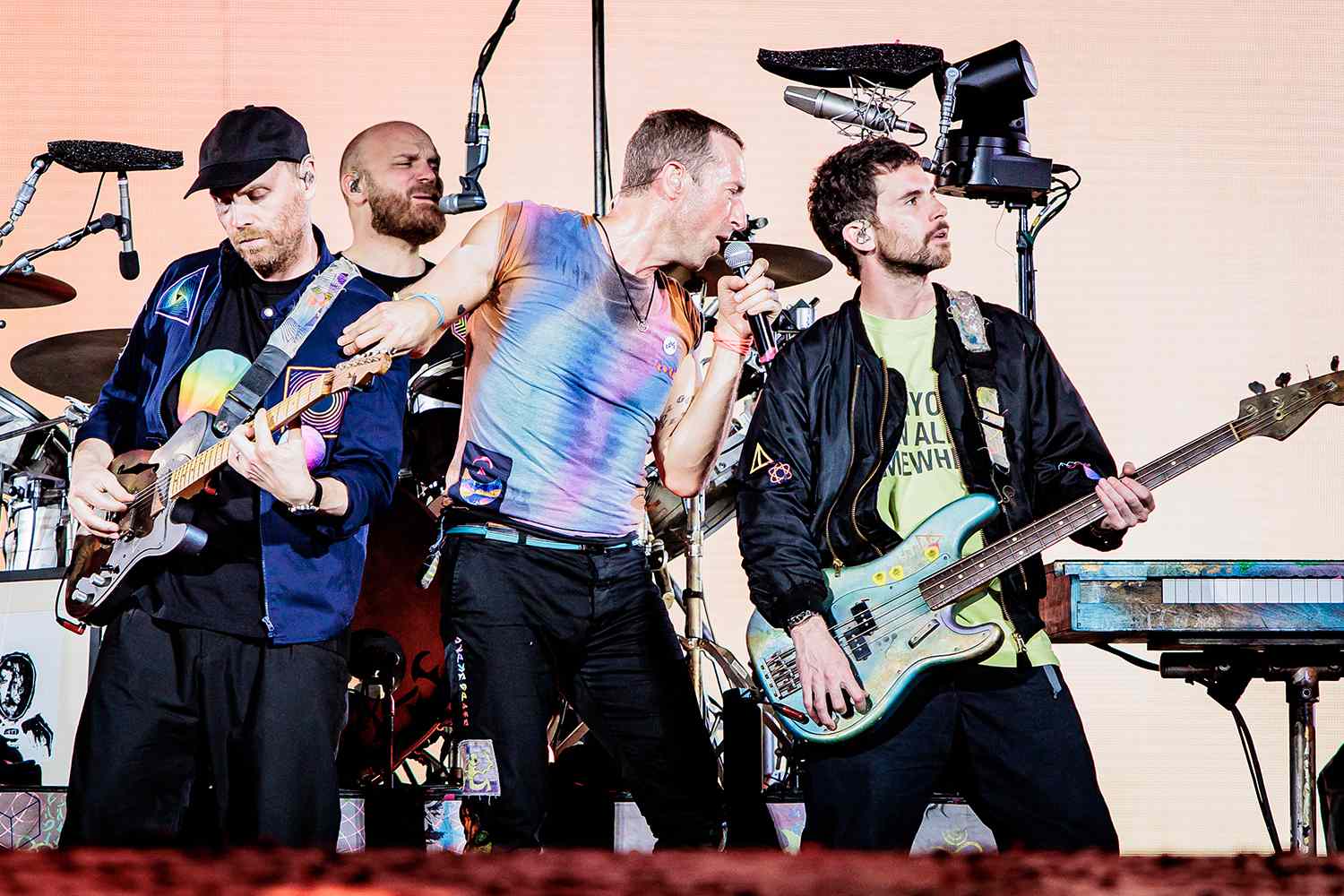 Jonny Buckland, Will Champion, Chris Martin and Guy Berryman of Coldplay perform at Stadio San Siro, on June 25, 2023 in Milan, Italy.