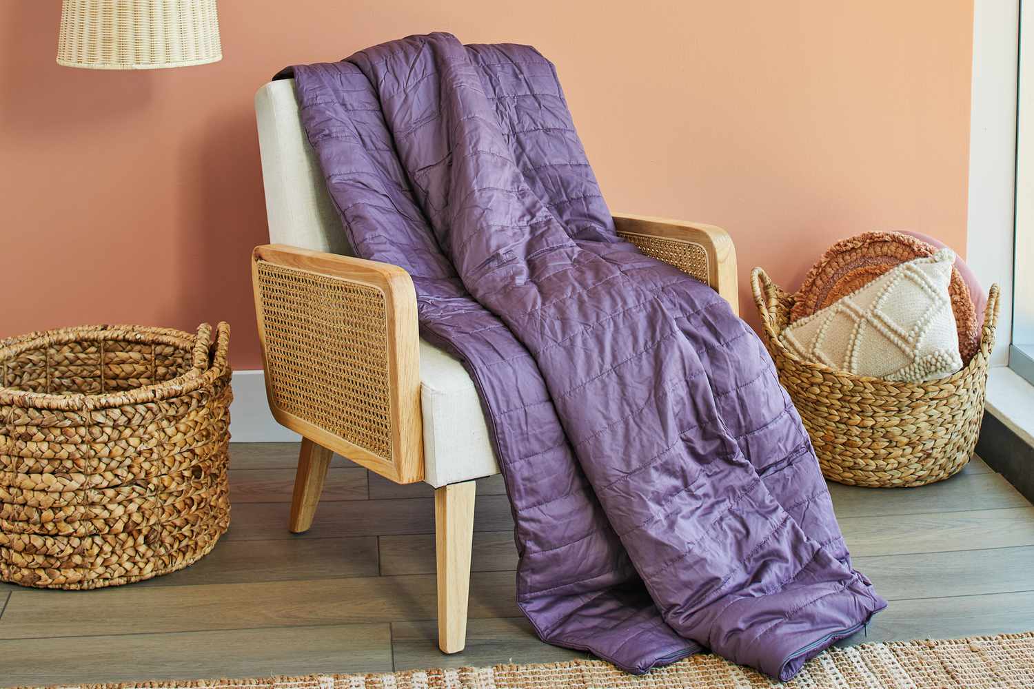 Sleep Number True Temp Weighted Blanket on a chair next to baskets 