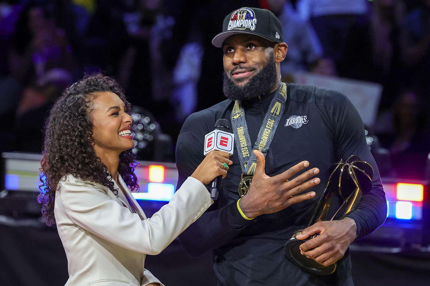 : Malika Andrews (L) interviews LeBron James #23 of the Los Angeles Lakers after he won the MVP trophy following the team's 123-109 victory over the Indiana Pacers to win the championship game of the inaugural NBA In-Season Tournament at T-Mobile Arena on December 09, 2023 in Las Vegas, Nevada.