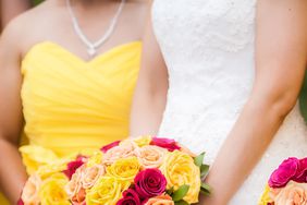 Bride with bridesmaid in yellow dress