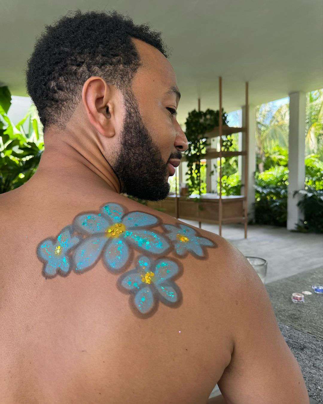 John legend vacation photo, back art by daughter Luna