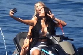 Kim Kardashian poses up a storm taking selfies during a jet ski ride with a pal in the Greek islands. 