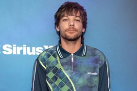 Louis Tomlinson visits 'Hits 1' with Nicole Ryan and Ryan Sampson at the SiriusXM Studios on September 16, 2022 in New York City.