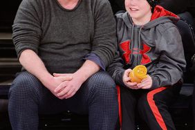 NEW YORK, NY - DECEMBER 25: Phillip Seymour Hoffman and Cooper Alexander Hoffman attend the Oklahoma City Thunder vs New York Knicks game at Madison Square Garden on December 25, 2013 in New York City. (Photo by James Devaney/WireImage)