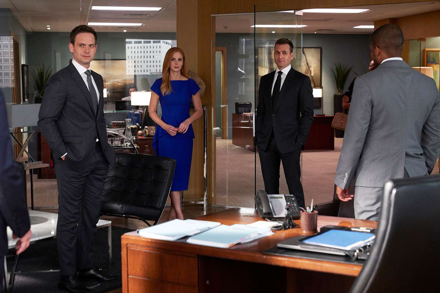 Patrick J. Adams as Mike Ross, Sarah Rafferty as Donna Paulsen, and Gabriel Macht as Harvey Specter on 'Suits'.