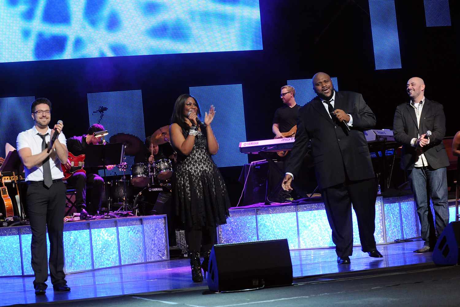 Danny Gokey, Mandisa, Ruben Studdard, and Phil Stacey perform onstage at the 43rd Annual GMA Dove Awards 