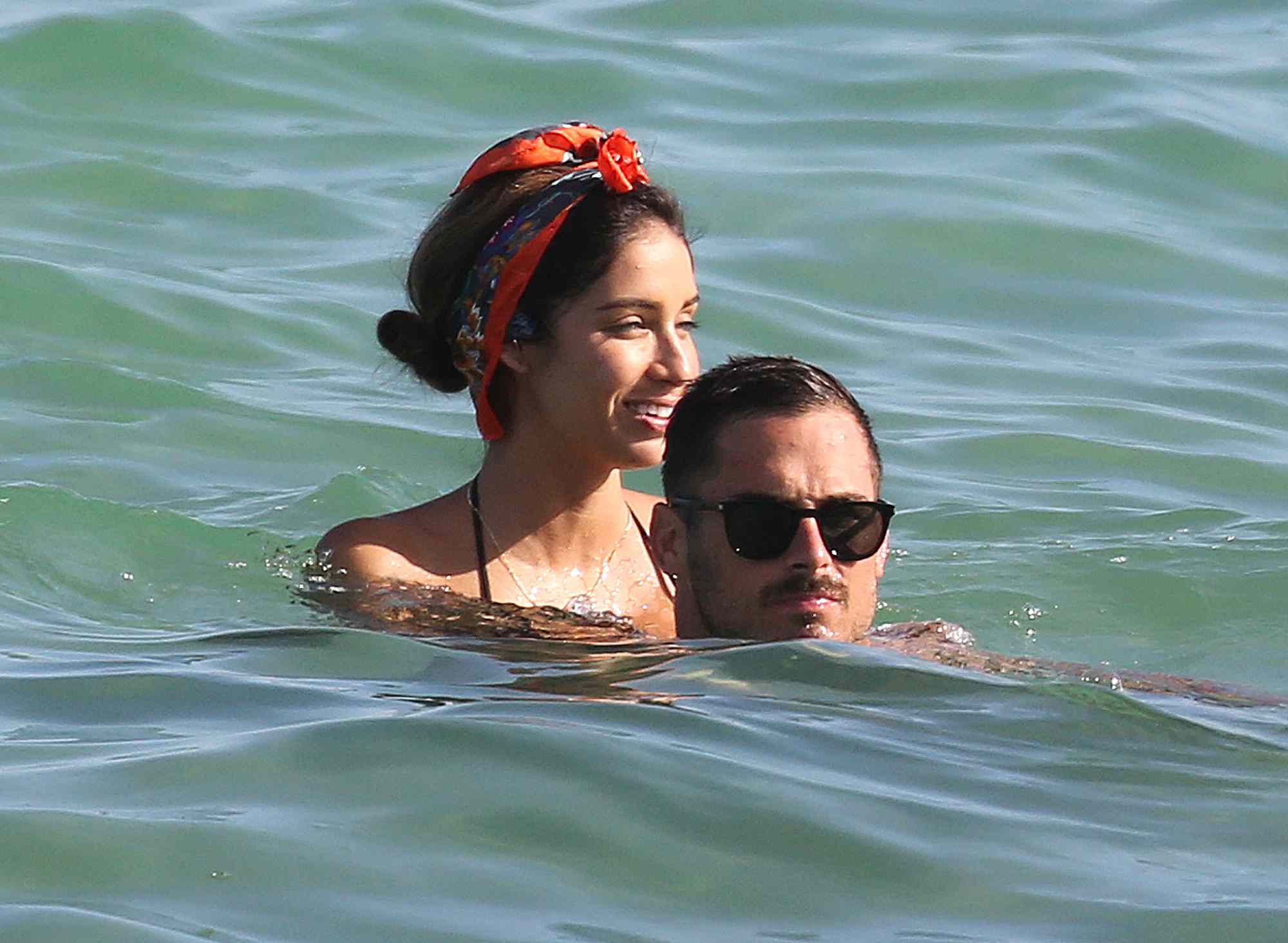 EXCLUSIVE: NFL star Danny Amendola shows PDA with a bikini clad woman on the beach in Miami, while girlfriend Olivia Culpo is in LA