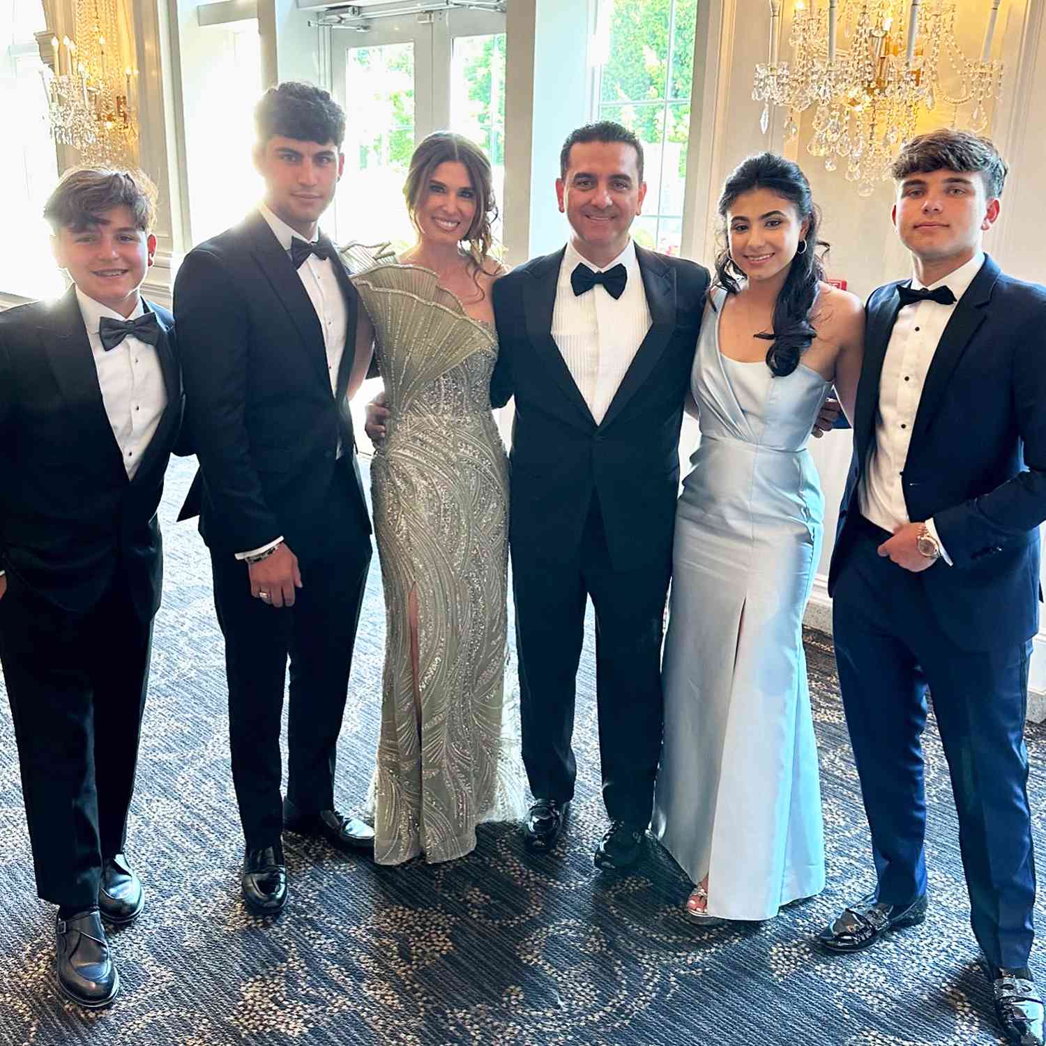 Buddy Valastro poses with family at a wedding