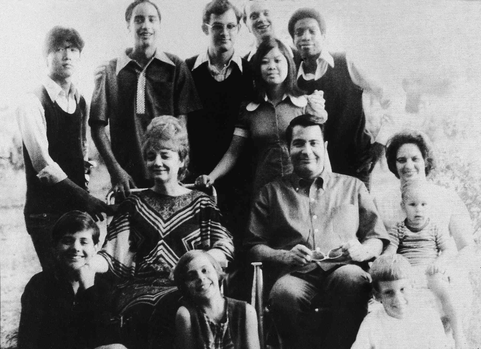 Jim Jones and Marceline Jones with their adopted children and next to his sister-in-law with her three children in 1976.