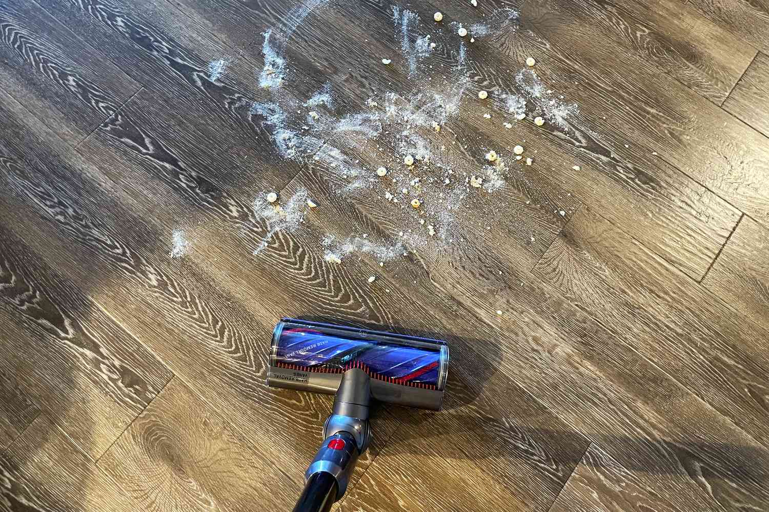 The Dyson V8 Vacuum cleans a wood floor