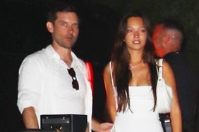 49-year-old actor Tobey Maguire may be taking some dating advice from best pal Leonardo DiCaprio! The Spider-Man star was seen with 20-year-old Lily Chee on his arm at Michael Rubin's star-studded 4th of July bash yesterday