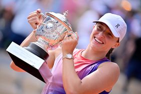 Iga Swiatek of Poland holds the Suzanne Lenglen Trophy after winning the Women's Singles Final match against Jasmine Paolini of Italy on Day 14 of the 2024 French Open at Roland Garros on June 08, 2024 in Paris, France.