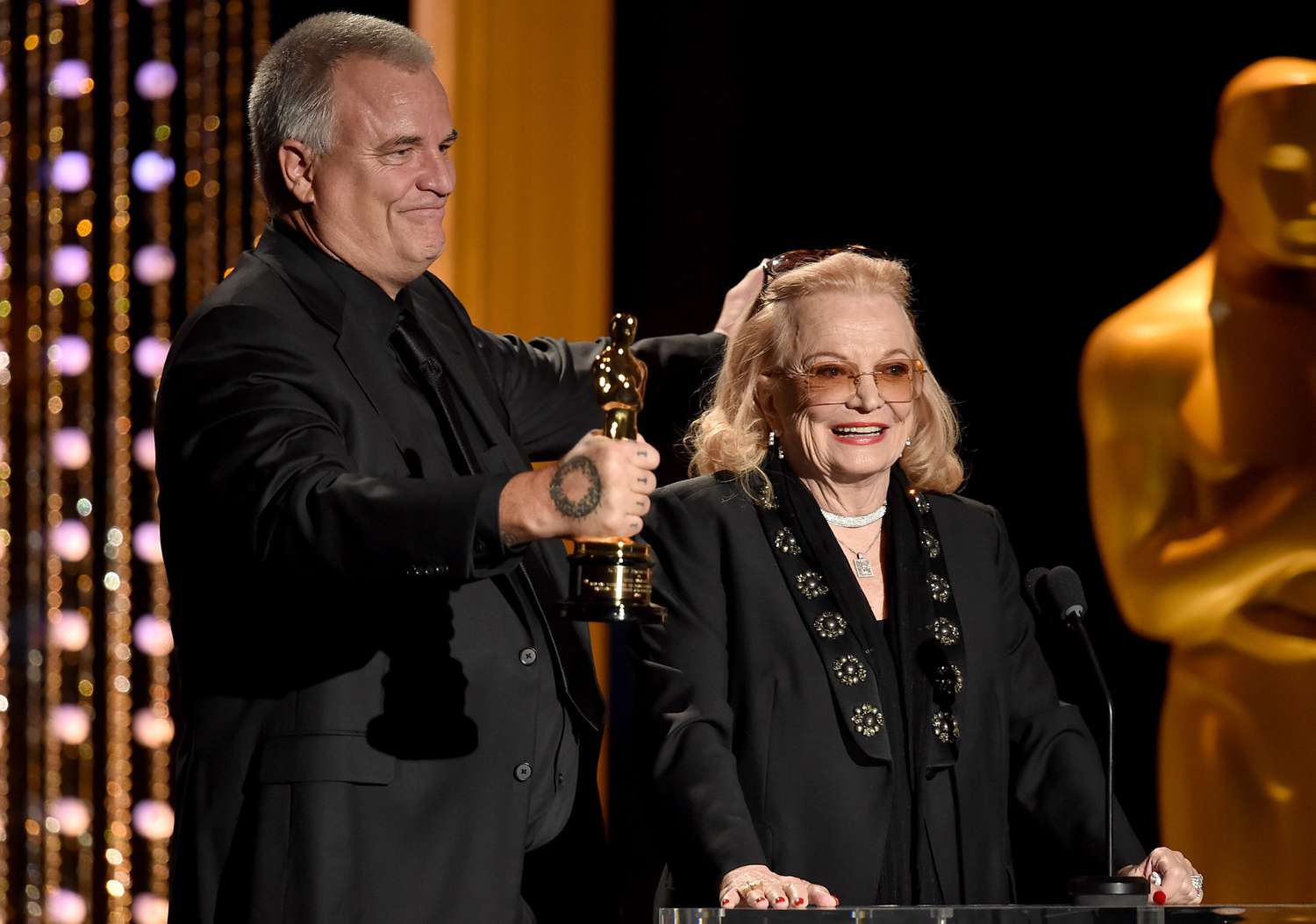 Actress Gena Rowlands (R) accepts an award from Nick Cassavetes onstage during the Academy of Motion Picture Arts and Sciences' 7th annual Governors Awards at The Ray Dolby Ballroom at Hollywood & Highland Center on November 14, 2015 in Hollywood, California.