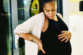 Eve shows off baby bump