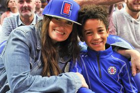 Idina Menzel and Walker Nathaniel Diggs attend a basketball game between the Los Angeles Clippers and the Charlotte Hornets at Staples Center on October 28, 2019 in Los Angeles, California