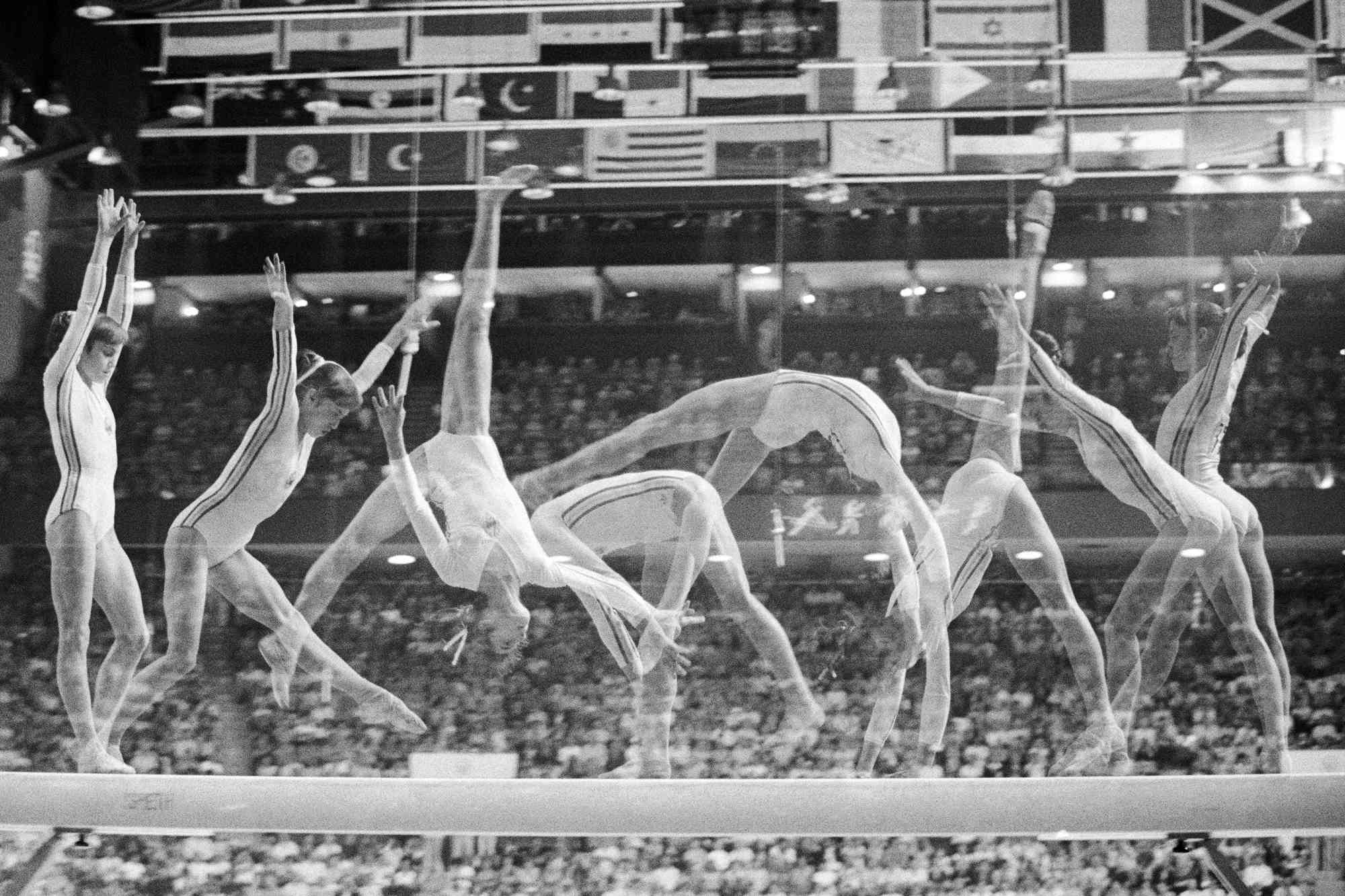 Multiple exposure show's Romania's Nadia Comaneci on the balance beam in Olympic women gymnastics 7/22, as she went on to win her second gold medal of the night, and her third of the games. She is the first gymnast to be awarded a perfect score of 10.0 at the Olympic Games. 