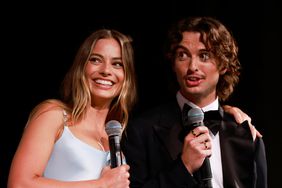 Margot Robbie and Cameron Robbie attend the Australian Premiere of Babylon at State Theatre on January 16, 2023 in Sydney, Australia.