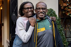 Deborah Roberts and Al Roker during a Christmas caroling surprise