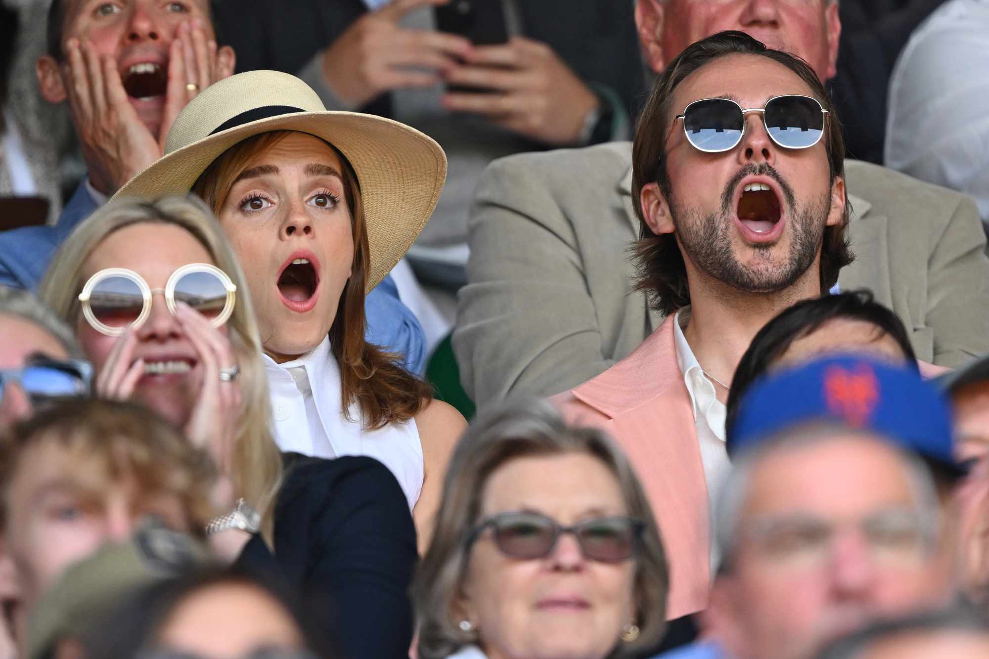 Emma Watson (L) watches Carlos Alcaraz vs Novak Djokovic in the Wimbledon 2023