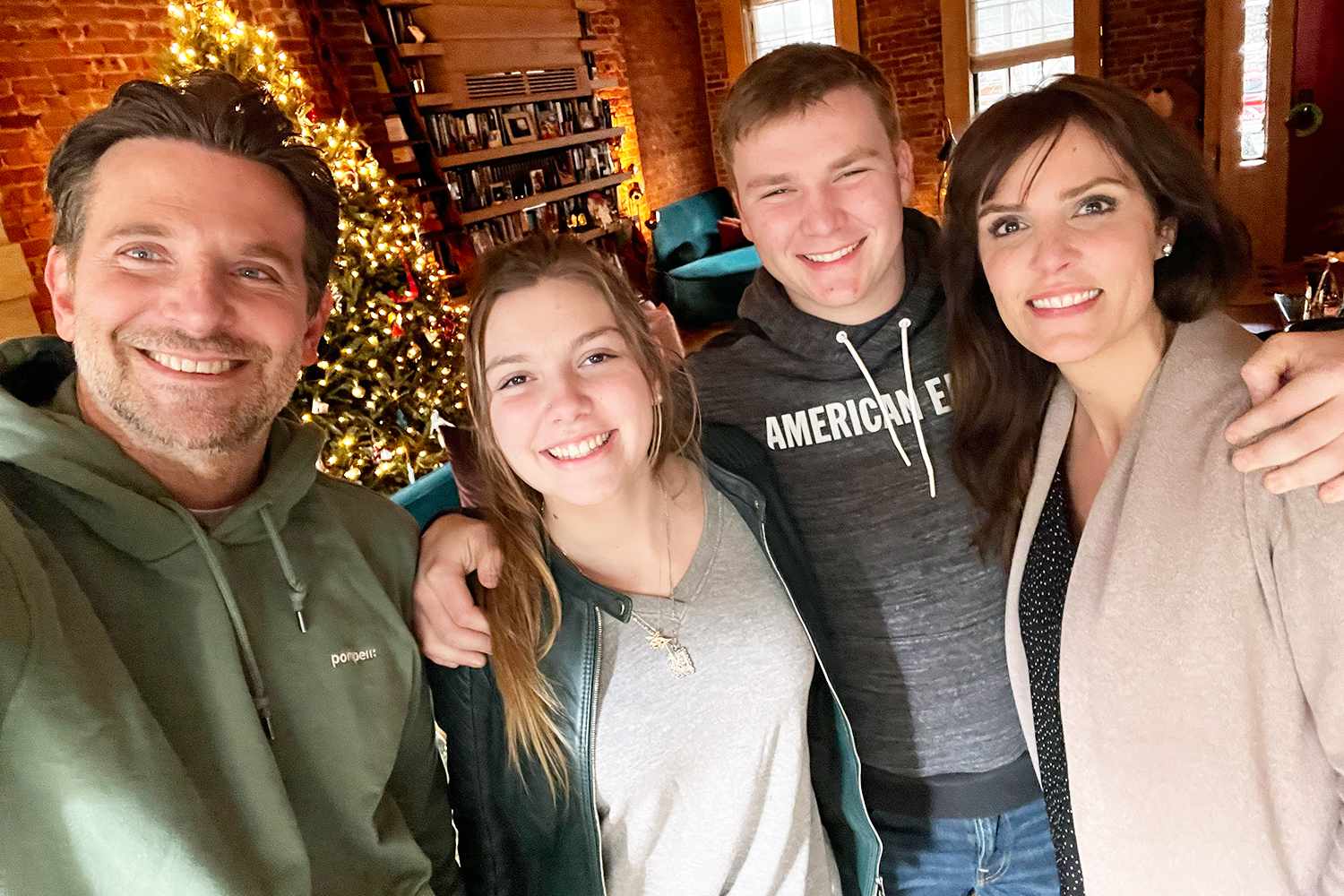 Taya Kyle and her children Colton and McKenna visit with Bradley Cooper and watch American Sniper for the first time. December 2022 in New York at Bradley's home.