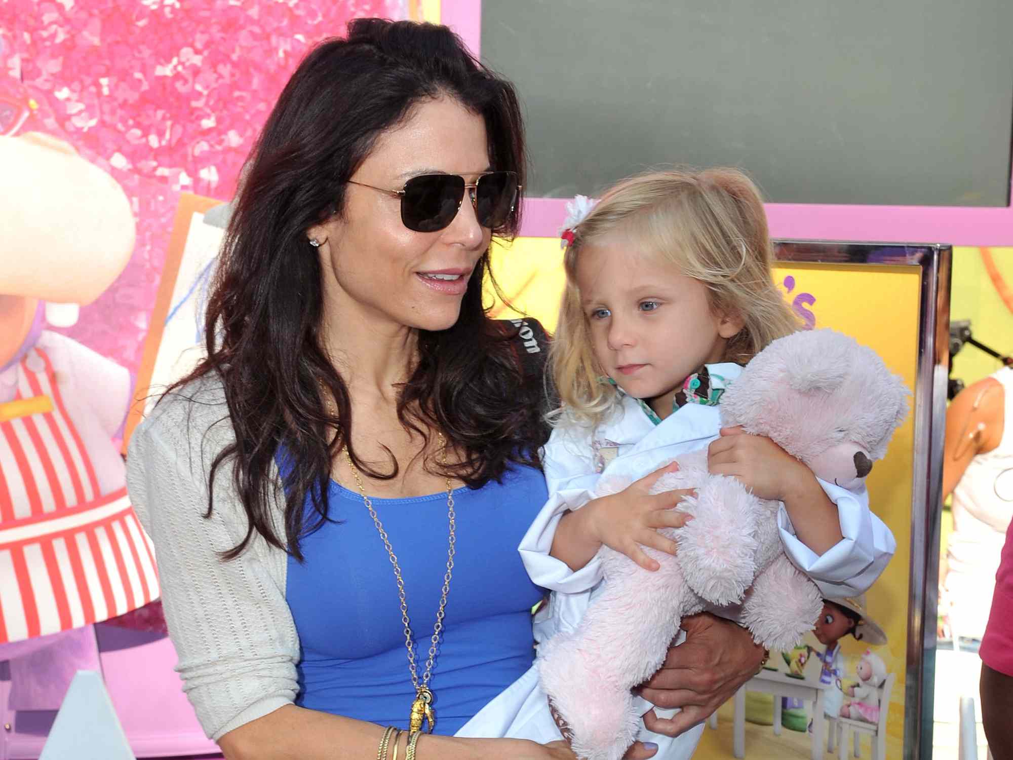 Bethenny Frankel and daughter Bryn Casey Hoppy (R) attend the Doc Mobile Tour at the Disney Store on August 21, 2013 in New York City