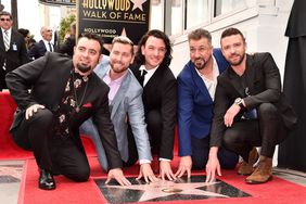 HOLLYWOOD, CA - APRIL 30: Singers Chris Kirkpatrick, Lance Bass, JC Chasez, Joey Fatone and Justin Timberlake of NSYNC are honored with a star on the Hollywood Walk of Fame on April 30, 2018 in Hollywood, California. (Photo by Alberto E. Rodriguez/Getty Images)