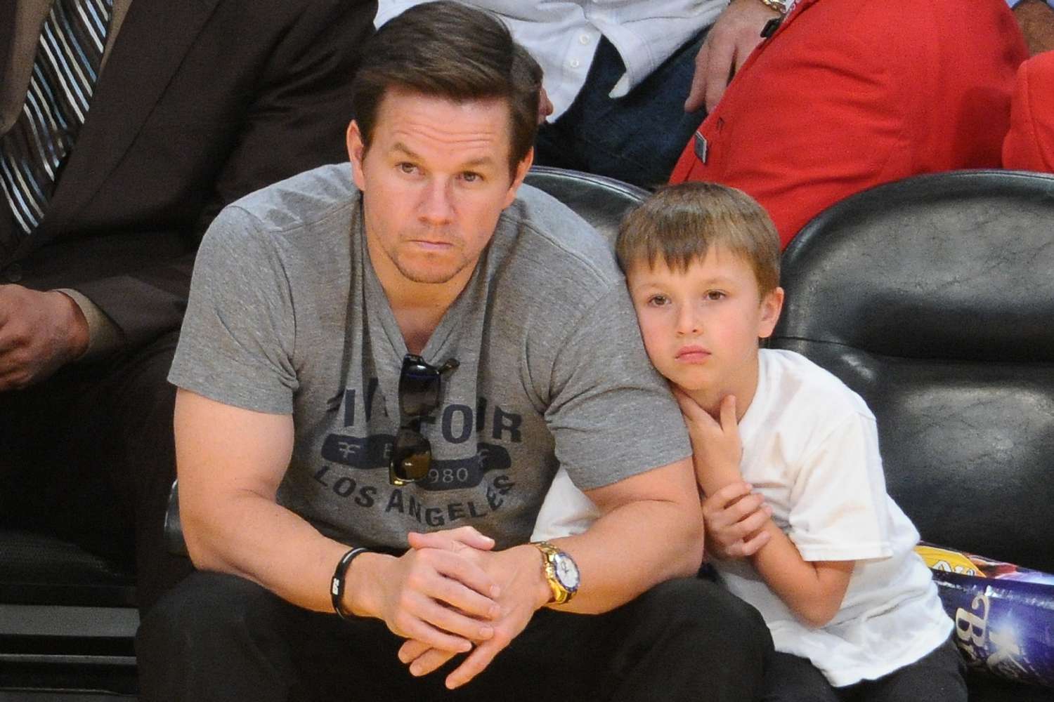 Mark Wahlberg (L) and his son Michael Wahlberg attend a basketball game between the Miami Heat and the Los Angeles Lakers