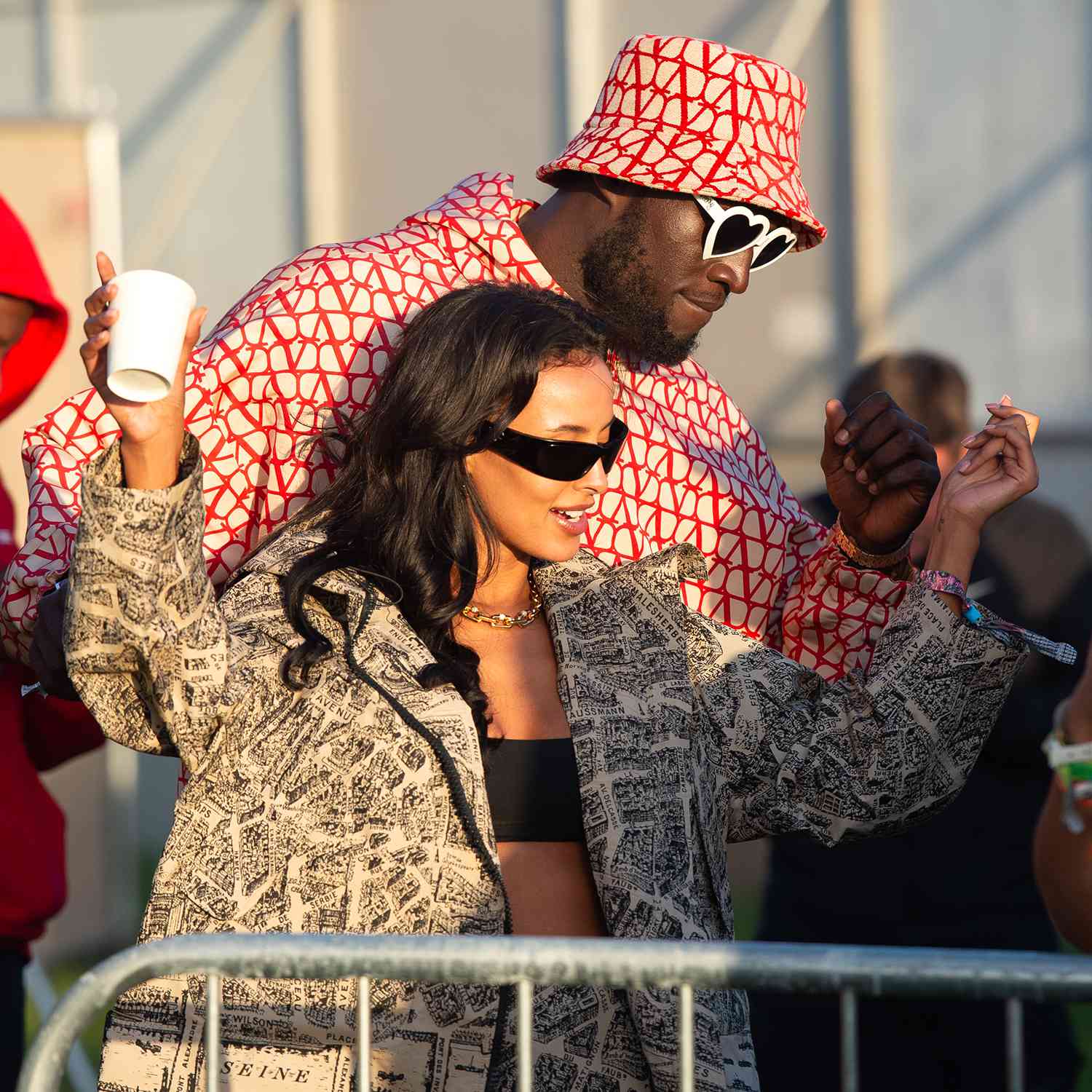 Stormzy and Maya Jama watch D-Block Europe perform during day three of Glastonbury Festival 2024 at Worthy Farm, Pilton on June 28, 2024 in Glastonbury, England. 