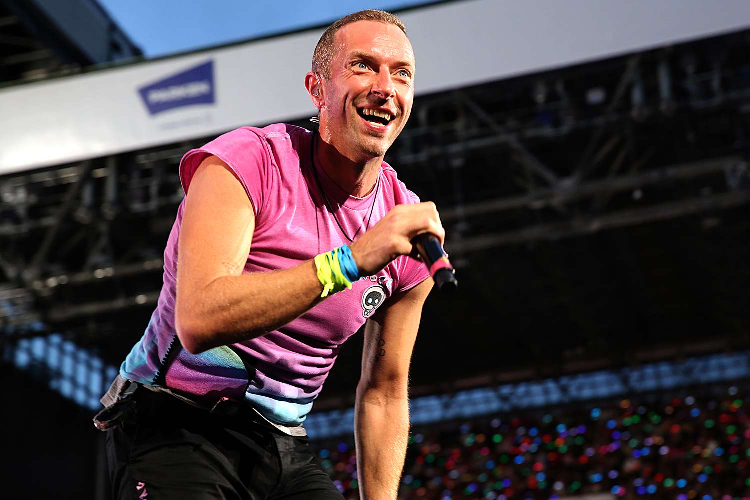 Chris Martin of Coldplay performs live on stage at Parken Stadium