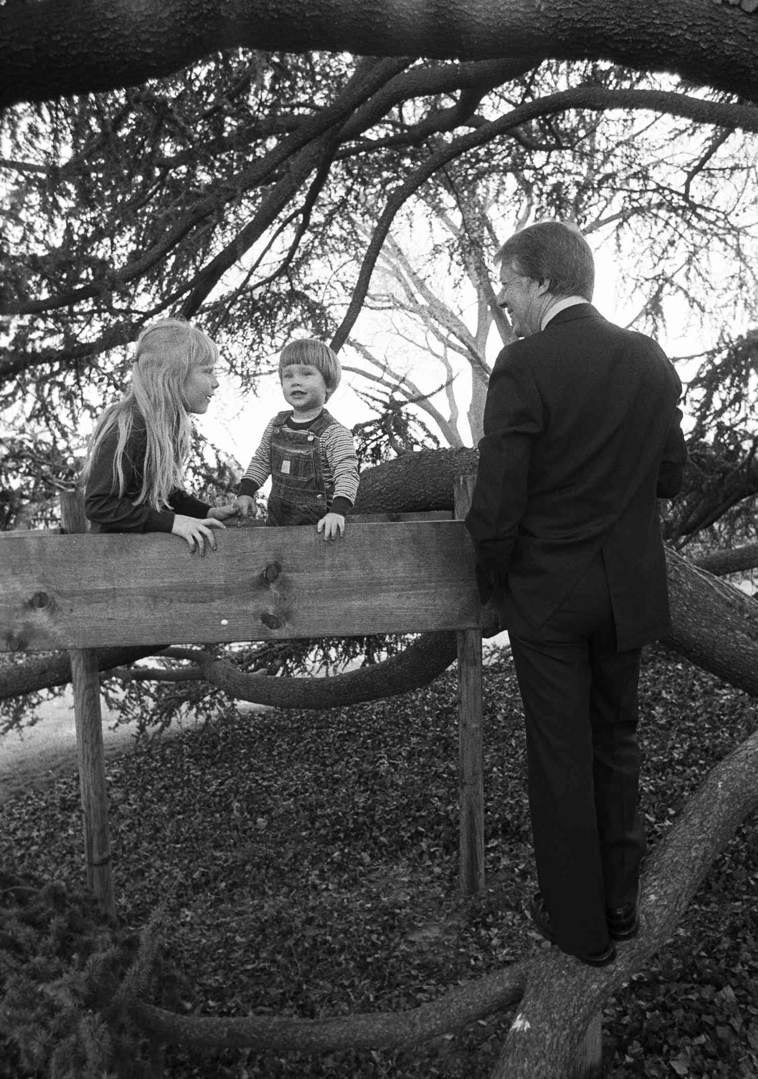 Photo of President Jimmy Carter with daughter Amy and grandson Jason on the South Lawn of the White House