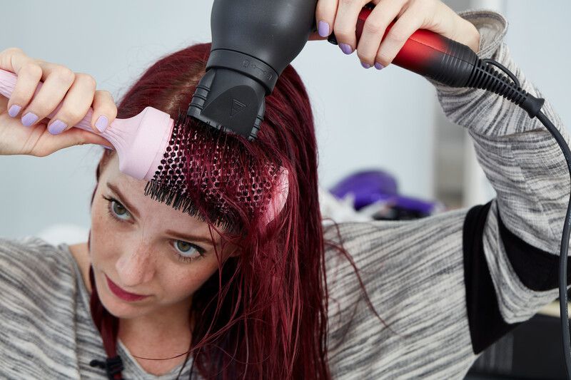 person uses Chi Lava Hair Dryer to dry hair