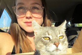 Megan Kolioupoulos poses with her cat