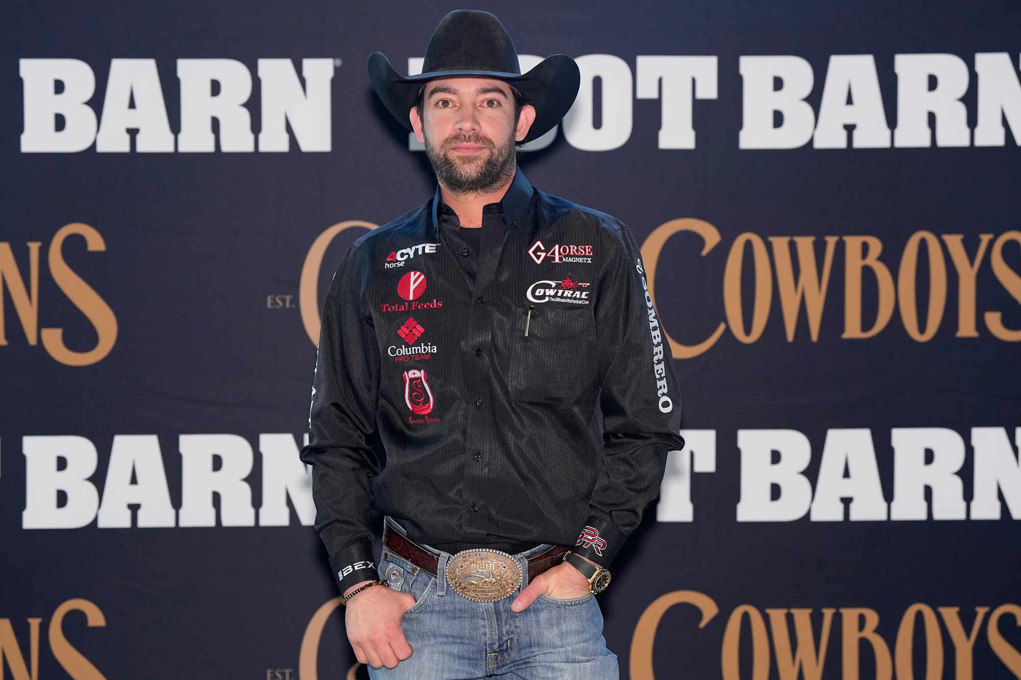  Adan Banuelos arrives at the Cowboys & Indians Magazine X Boot Barn Grit & Glamour VIP Denim Carpet Party poses for a photo opportunity during The American Rodeo by Teton Ridge at Globe Life Field on March 09, 2024 in Arlington, Texas