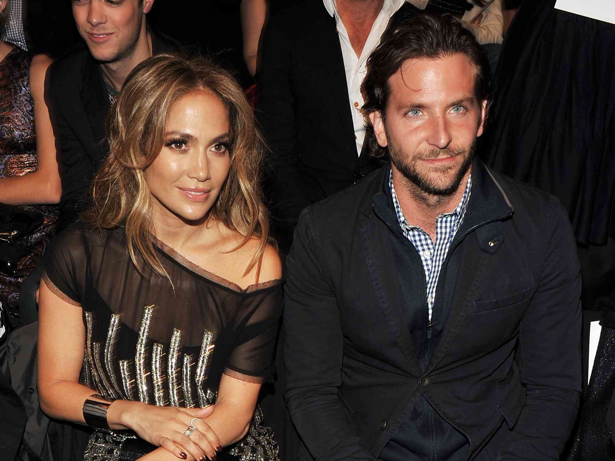 Jennifer Lopez (L) and actor Bradley Cooper attend the Tommy Hilfiger Spring 2011 Men's and Women's show during Mercedes-Benz fashion week at Lincoln Center on September 12, 2010 in New York City