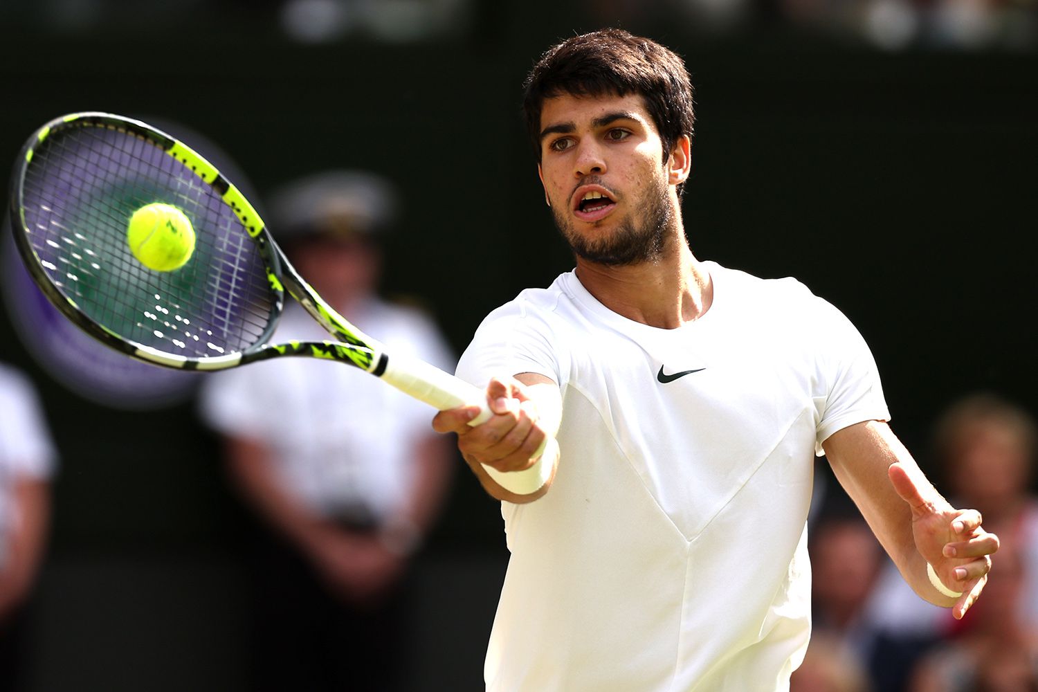 arlos Alcaraz of Spain plays a forehand in the Men's Singles Final against Novak Djokovic of Serbia on day fourteen of The Championships Wimbledon 2023