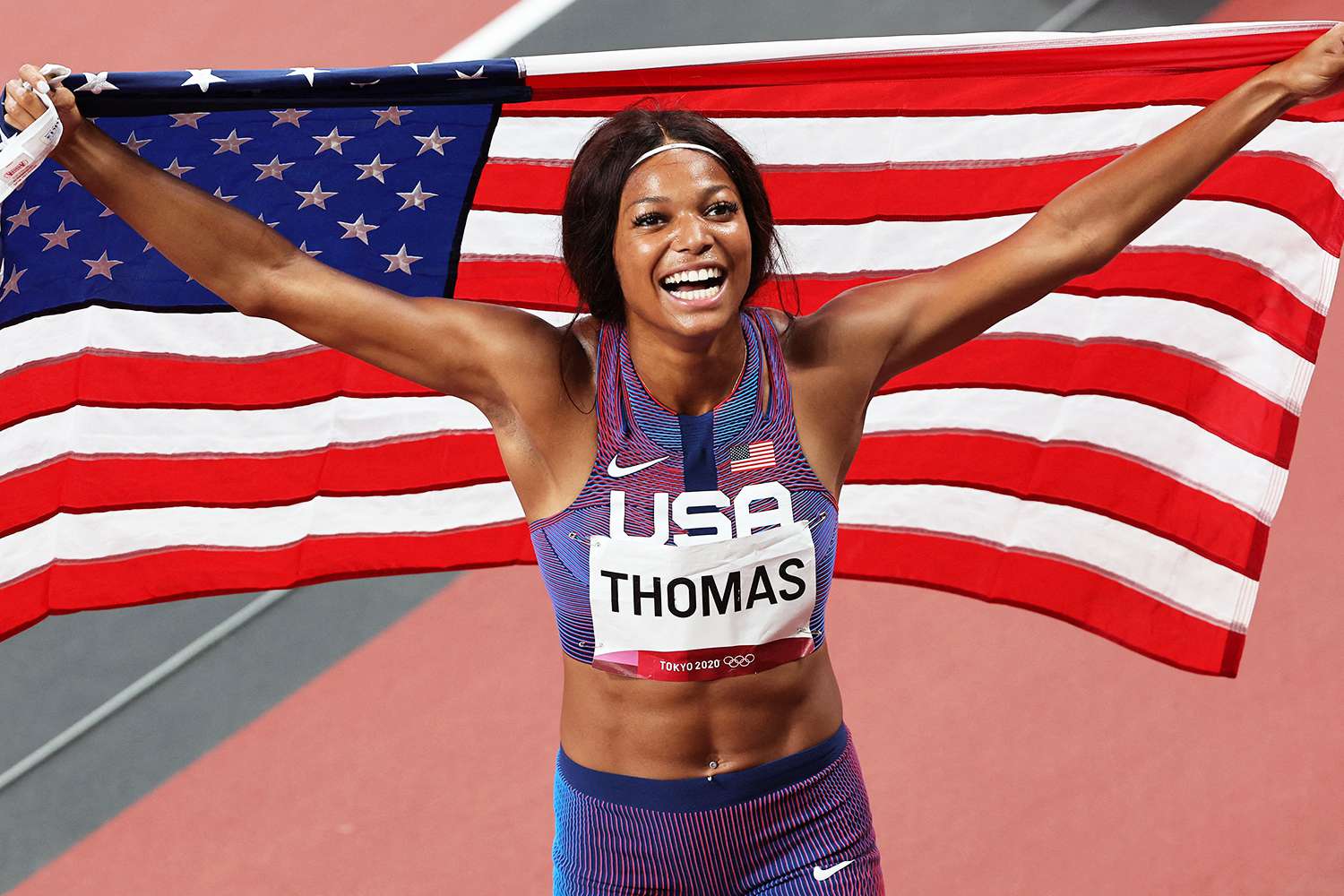 Gabrielle Thomas celebrates after taking bronze in the women's 200m final during the Tokyo 2020 Olympic Games at the Olympic Stadium in Tokyo on August 3, 2021.