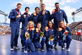 U.S. Olympic figure skating team pose for a photo after receiving gold medals following the disqualification of Team Russia for doping after the 2022 Winter Games in Beijing on day twelve of the Olympic Games Paris 2024 at Champions Park on August 07, 2024