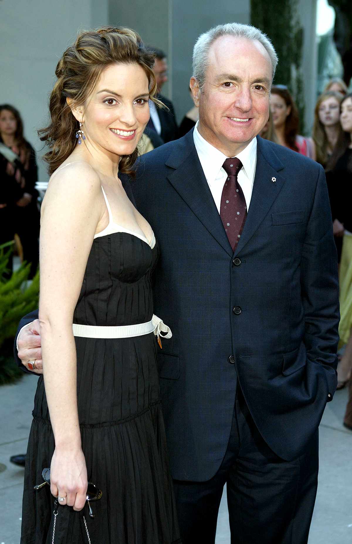 Actress/screenwriter Tina Fey (L) and producer Lorne Michaels pose at the premiere of Paramount's "Mean Girls" at the Cinerama Dome, on April 19, 2004 in Los Angeles, California.