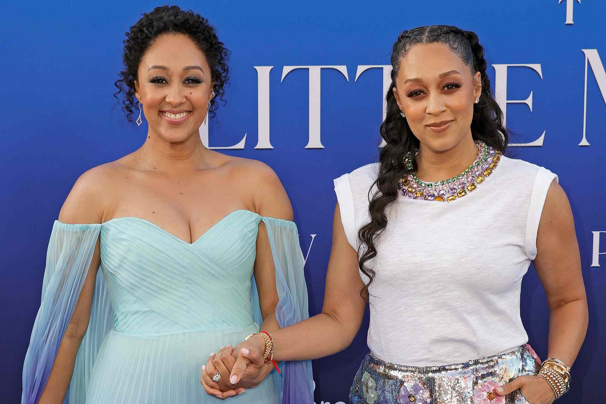 Tamera Mowry-Housley and Tia Mowry attend the world premiere of Disney's "The Little Mermaid" on May 08, 2023 in Hollywood, California.