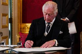 Britain's King Charles III signs an oath to uphold the security of the Church in Scotland, during a meeting of the Accession Council inside St James's Palace in London on September 10, 2022, to proclaim him as the new King. - Britain's Charles III was officially proclaimed King in a ceremony on Saturday, a day after he vowed in his first speech to mourning subjects that he would emulate his "darling mama", Queen Elizabeth II who died on September 8. (Photo by Victoria Jones / POOL / AFP) (Photo by VICTORIA JONES/POOL/AFP via Getty Images)